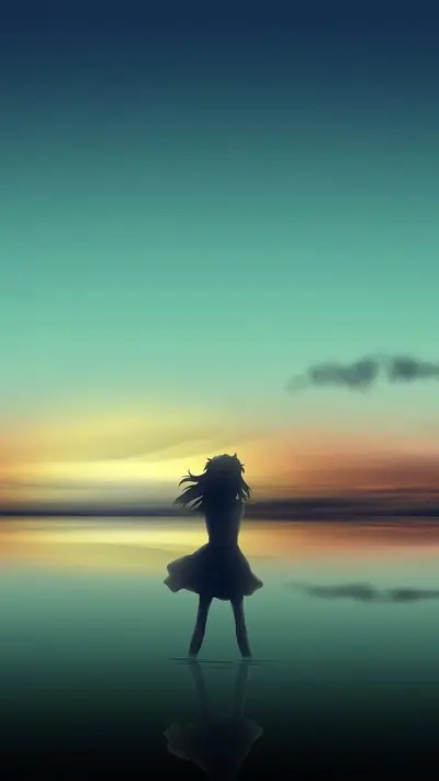 Silhouette of a girl standing in water, with a colorful sky in the background