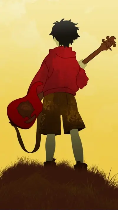Silhouette of a person with a guitar on a hill