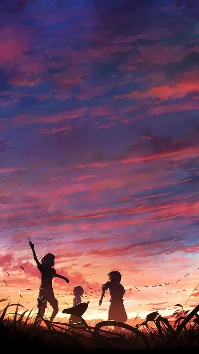 Silhouetted figures against a vibrant sunset