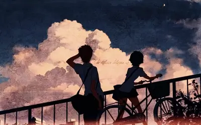 Silhouettes standing on bridge against cloudy sky at dusk