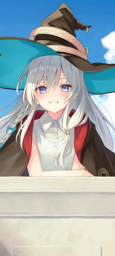 Smiling girl in a teal witch hat