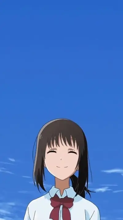 Smiling girl under clear sky, dark brown hair, red bow