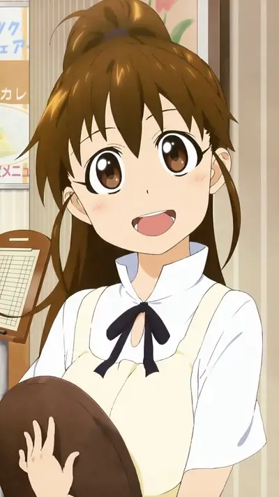 Smiling girl with brown hair in a cafe apron