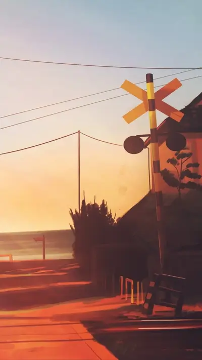 Sunset view of a railway crossing near the sea
