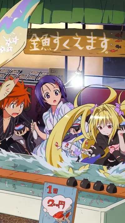 Three girls at a goldfish scooping game