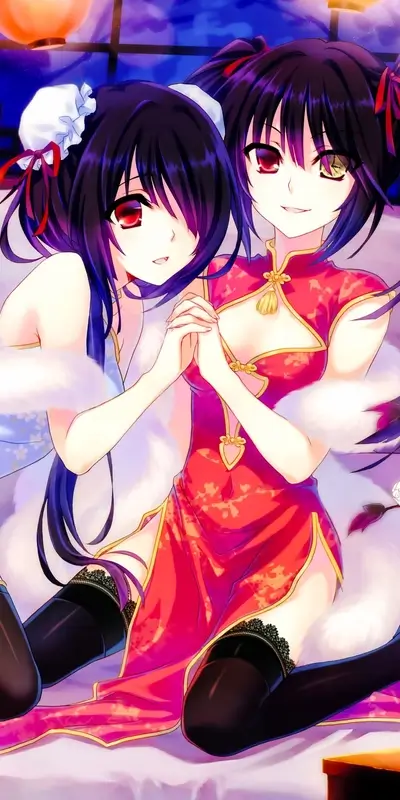 Two beautiful girls in charming red dresses, adorable