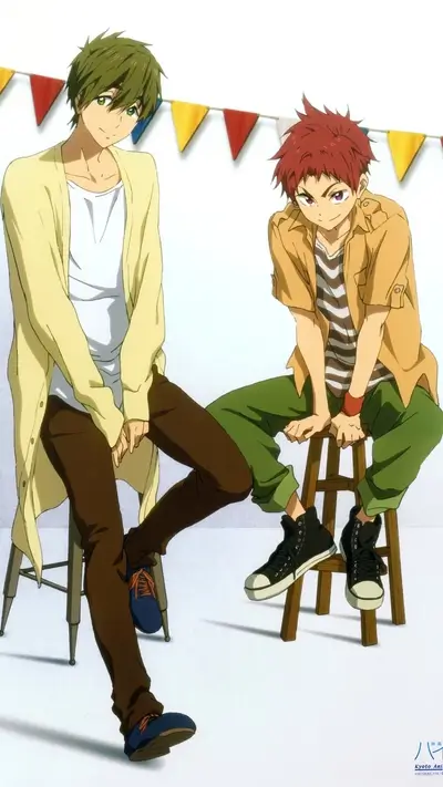 Two boys sitting on chairs in a casual setting