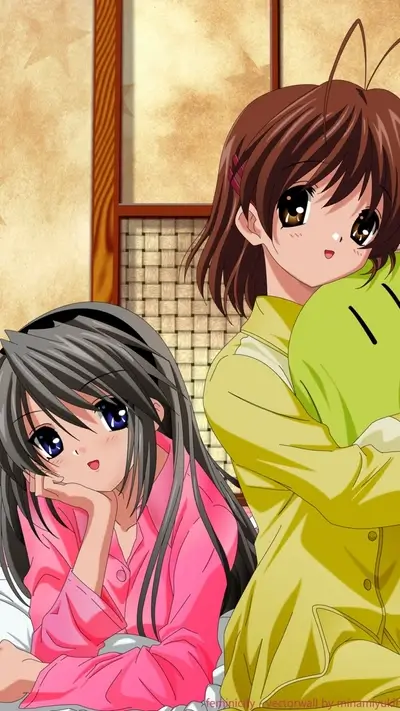 Two cute anime girls in pajamas, one holding a green doll