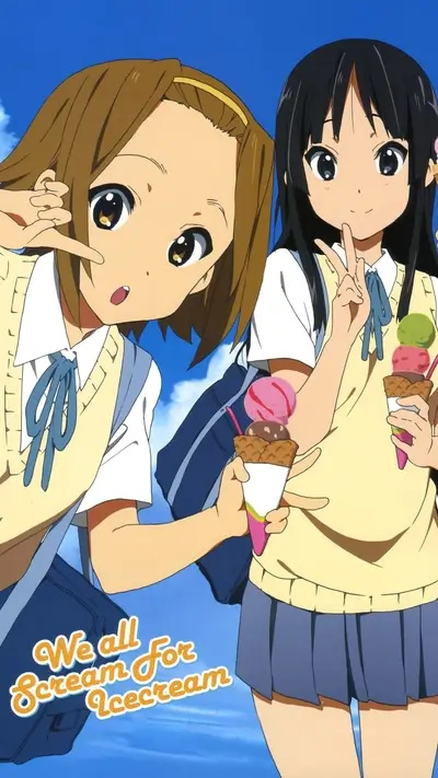 Two girls enjoying ice cream on a sunny day