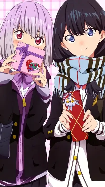 Two girls exchanging Valentine's Day gifts