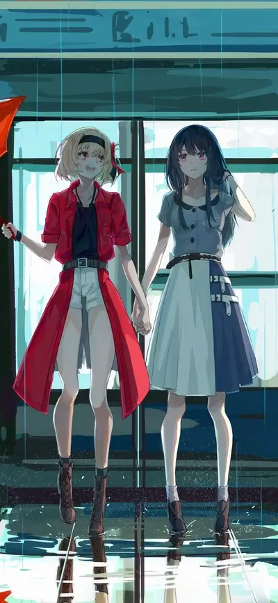 Two girls holding hands under an umbrella in the rain