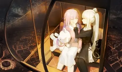 Two girls in a Ferris wheel at night
