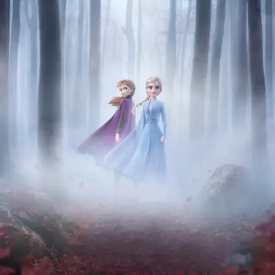 Two girls in a foggy forest