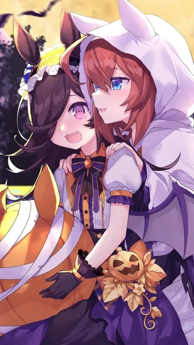 Two girls in Halloween costumes embracing