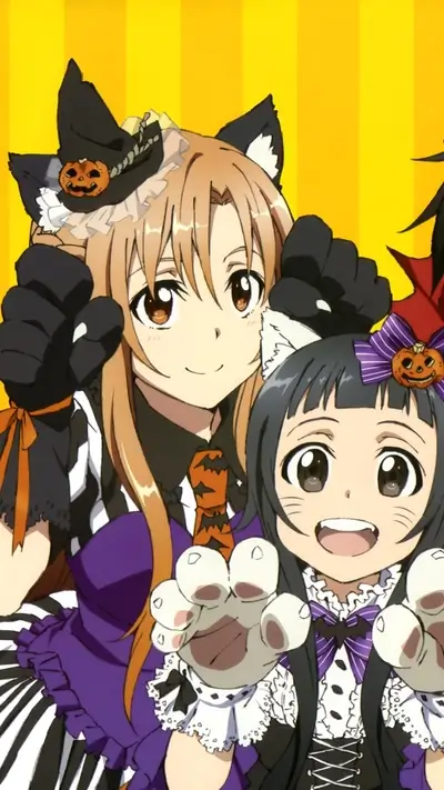 Two girls in Halloween costumes