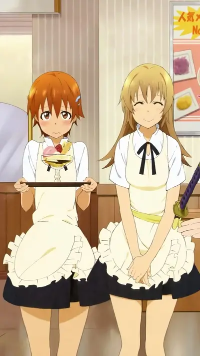 Two girls in maid outfits, one holding a dessert