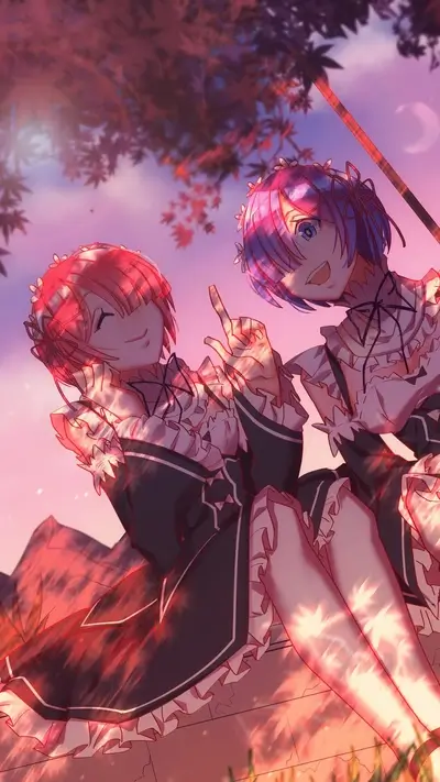 Two girls in maid outfits sitting on a wall