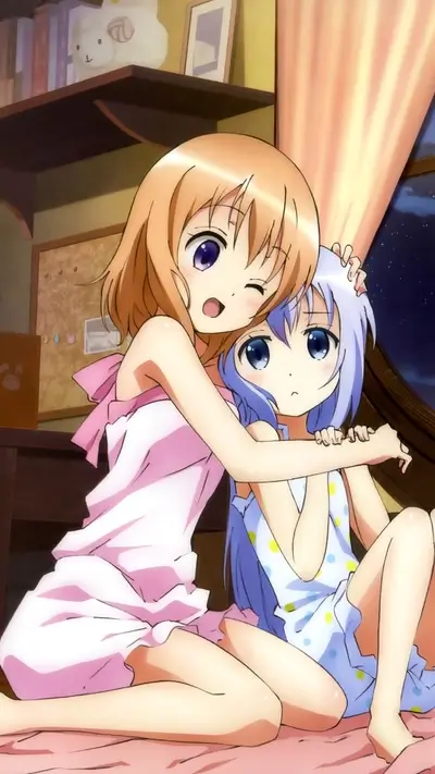 Two girls in pajamas hugging