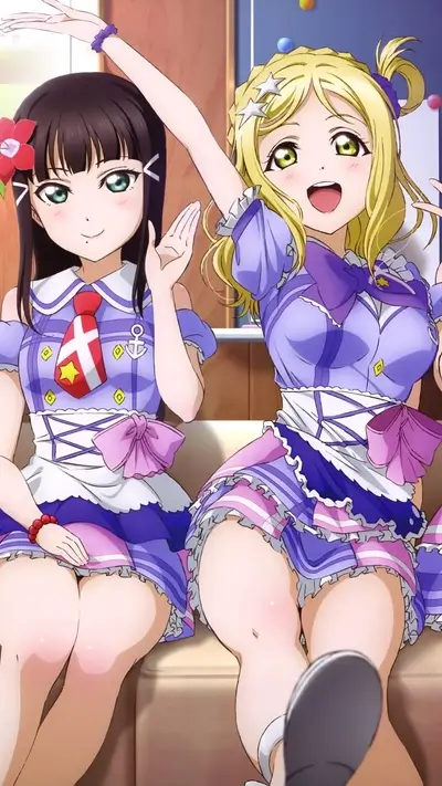 Two girls in sailor outfits smiling