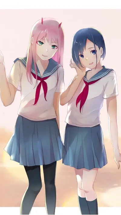 Two girls in sailor uniforms standing together