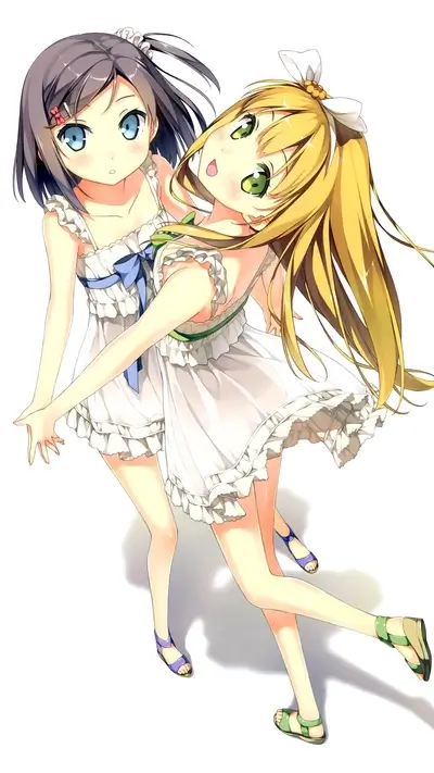 Two girls in white dresses, smiling