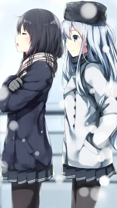 Two girls in winter clothes standing together