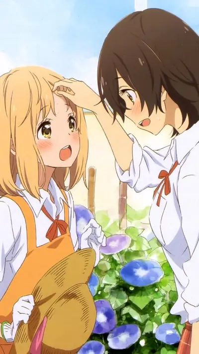 Two girls interacting near morning glories