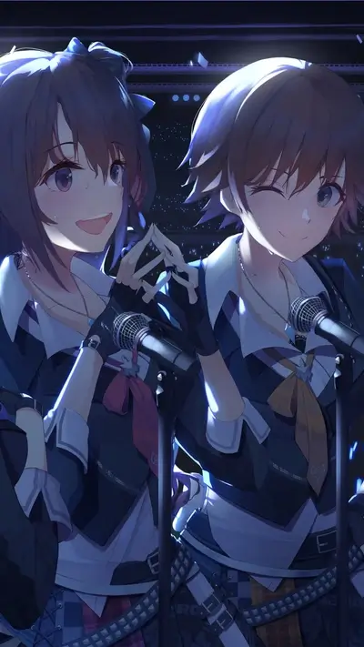 Two girls singing on stage, holding microphones