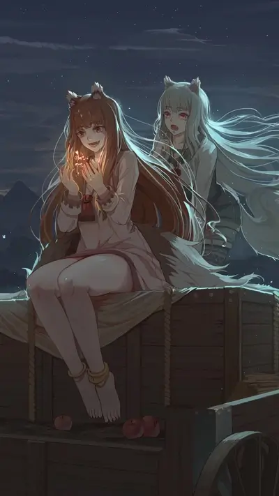 Two girls sitting on a wagon at night