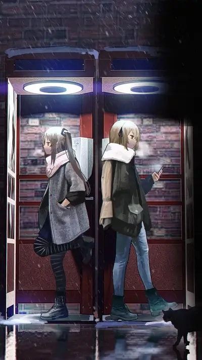 Two girls standing near phone booths on snowy night