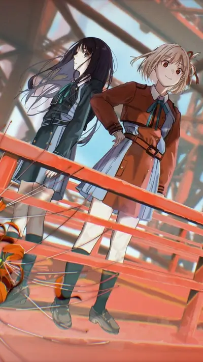 Two girls standing on a red bridge