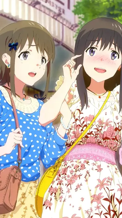 Two girls walking down a street, one in a floral dress