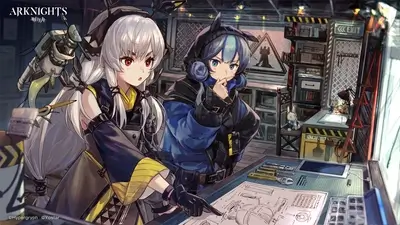 Two girls working on blueprints in a workshop