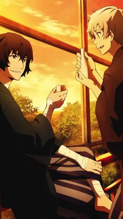 Two men drinking together by a window during sunset