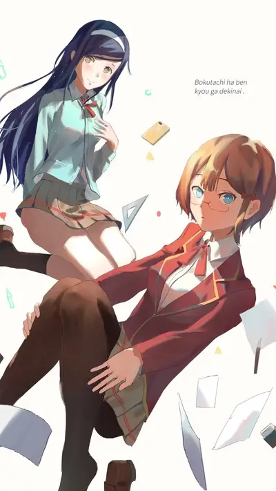 Two schoolgirls sitting amidst scattered papers