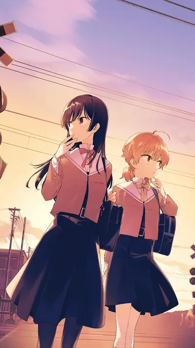Two schoolgirls walking at sunset