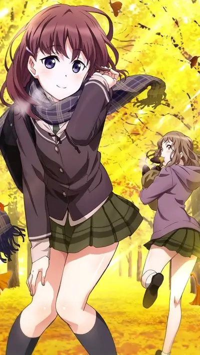 Two schoolgirls walking in autumn leaves