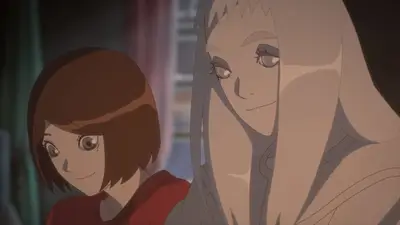 Two sisters smiling side by side indoors