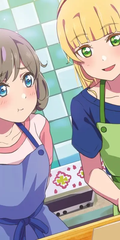 Two smiling girls in aprons, ready to cook or bake