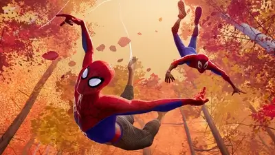 Two Spider-Man characters swinging through autumn trees