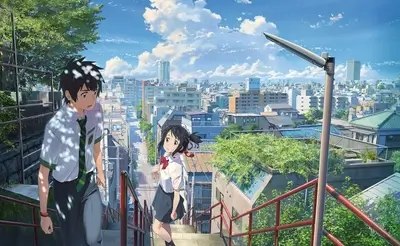 Two students walking up a staircase in a Japanese city