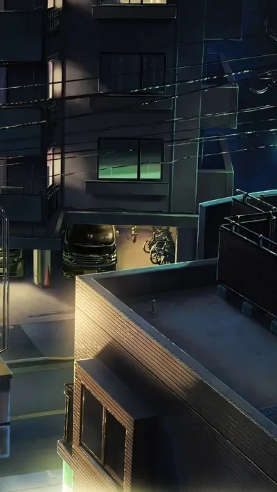 Urban scene at night with apartment buildings, cars, and bikes