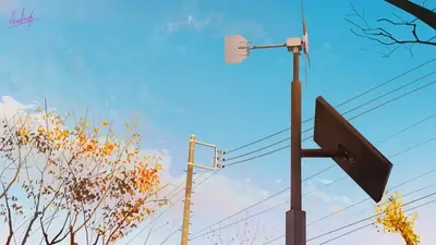 Wind turbine and solar panel against a blue sky with autumn trees