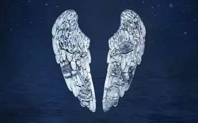 Wings with intricate details against a dark blue background
