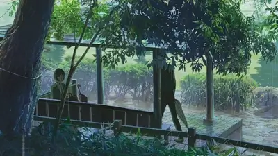 Woman sitting under a park pavilion during a rainy day