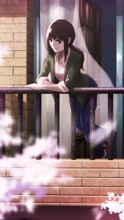 Woman stands on balcony looking pensively into the distance