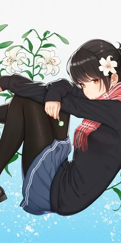 Young girl with a flower in her hair is relaxing.